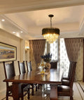Modern Crystal Chandelier 3 Tier Round Black And Gold Pendant Light With 12 LED Bulbs in elegant dining room setting