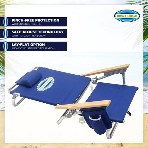 Lay Flat Five Position Backpack Beach Chair in navy with easy adjustments and kickback mode on a sandy beach.