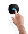 Hand adjusting 3 Lite Wi Fi Thermostat With Alexa Voice Control For Hands Free Comfort, Smart Home Ready on wall