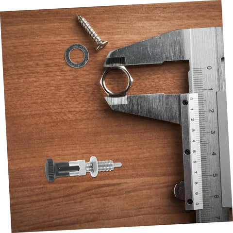 Heavy Duty Stainless Steel Spring Loaded Latch Pin Indexing Plunger Locking Knob With Knurled Handle and Quick Release Pull on a wooden surface.