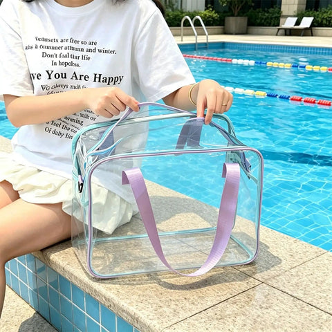 Poolside view of transparent Dry Wet Separated Storage Bag for Gym and Beach Gear, with separate compartments and purple straps.