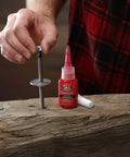 Perma Lock High Strength Threadlocker Red 36 Ml For Heavy Duty Bolts And Fasteners That Lock In Place Against Vibration And Shock Pro Grade Sealant For Mechanical Projects shown with bolt and wood.