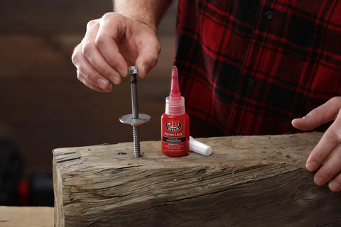 Perma Lock High Strength Threadlocker Red 36 Ml For Heavy Duty Bolts And Fasteners That Lock In Place Against Vibration And Shock Pro Grade Sealant For Mechanical Projects shown with bolt and wood.