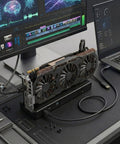 Next Level 80Gbps eGPU Enclosure For Thunderbolt 5 And USB4 Systems, showcasing GPU dock setup with laptop and monitor.