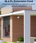 Image of Ultra Bright Solar Outdoor Flood Lights 2800LM With 16.4 Ft Cable Remote Control Motion Sensor 3 Modes Solar Powered Security Lights For Yard Patio Garage Four Pack installed on modern house exterior.