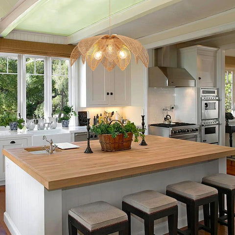 Handcrafted Rattan Chandelier With Three Bright Bulbs For Your Dining Room Or Kitchen Island above a wooden kitchen island.