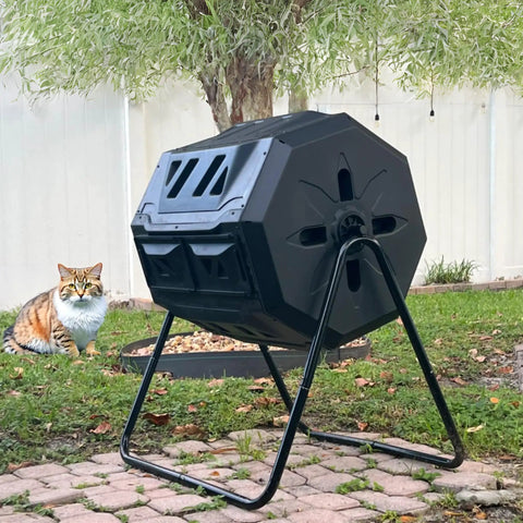 42 Gallon Black Outdoor Garden Compost Tumbler Bin With Dual Chambers Rotating For Continuous Composting And Yard Waste, in garden setting