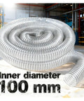Heavy Duty Bellows Flex Hose For Shop Vacs And Industrial Dust Extractors 100mm clear sawdust collector pipe coiled in workshop.