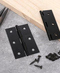 Front view of two black 3-inch stainless steel door hinges with screws and mounting hardware.