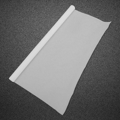Nonstick PTFE Film Roll For Heat Press Transfers And Craft Projects, white sheet unrolled on textured background, reusable heat mat sheet