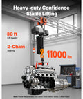 Heavy Duty 11000lb Electric Chain Hoist With Double Chain System And 30ft Lift Height for lifting an engine in a garage.