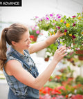 Woman using Six Point Five Inch Pruning Shears Set, Two Pack Garden Scissors with stainless blade on hanging plant in greenhouse.