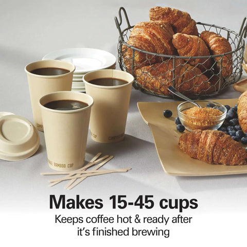 45 Cup Fast Brew Coffee Urn And Hot Beverage Dispenser with cups, croissants, and plates on a table setup for large gatherings.