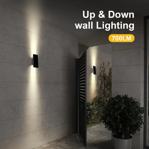 Rock Solid Solar Wall Lights With Up And Down Next Level Glow Built For Outdoor Patios Featuring All Season LED Beads mounted on a wall.