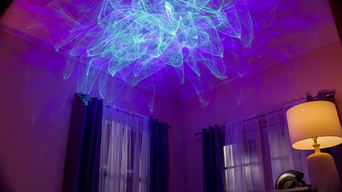 Room with Ark Lite LED Aurora Projector With Laser Nebula And Galaxy Lighting creating blue laser visuals on ceiling