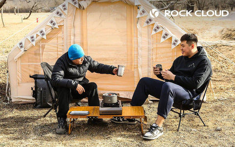Two people at campsite using Ultralight Portable Camping Table Foldable Three Folding Beach Table For Camping Hiking Garden Outdoor Picnic