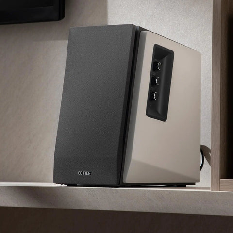 R1700BT Bluetooth Bookshelf Speakers With 66W RMS Power on a shelf, black front panel, white wood enclosure, and control knobs.