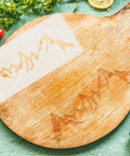 Super Slick Mountain Range Router Template Hella Thick Clear Acrylic Charcuterie Stencil For Awesome Woodworking Builds Pretty Tough Kitchen Cutting Board Pattern Jig on wooden cutting board.