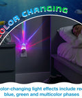 Tropical Aquarium LED Night Light with color changing glow illuminating a bedroom corner, showing red and blue phases.