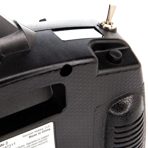 Close-up of DXS Transmitter With AR410 Receiver Delivers Smart Technology Telemetry showing ergonomic grip and control detail.
