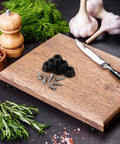 Durable PVC Furniture Feet Pads With Adhesive Backing 120 Sets Rubber Leg Bumpers shown with screws on cutting board