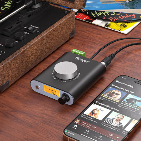 S5000 FM Radio Receiver With Si4730 Chip, Bluetooth And AUX In, compact desktop amplifier on wooden desk next to phone