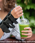 Woman wearing Thumb Spica Arthritis Support For Gamekeeper’s Thumb And Tendonitis enjoying a smoothie outdoors