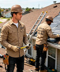 Mens Heavy Duty Mechanic Work Shirt With Custom Crew Logos Heavyweight Cotton Twill Button Up Long Sleeve Trade Ready Uniform worn on a job site.