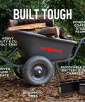 Electric Wheelbarrow Workhorse With 350 Lb Capacity And 6 Cu Ft Poly Tray, durable steel frame in wooded area with logs