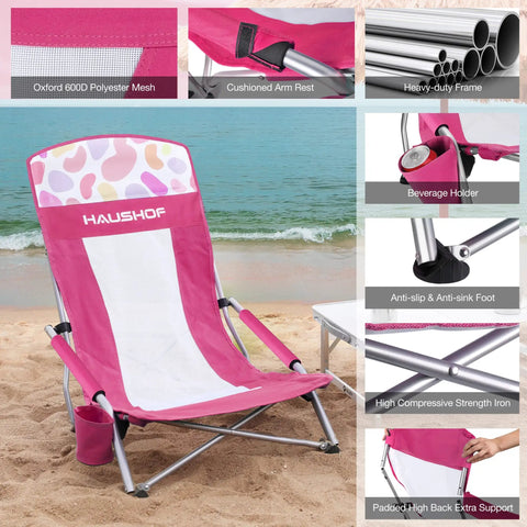 Low Seat Beach Chair With Mesh Back And Cup Holder Lightweight Foldable Camping Chair shown on sand with padded armrests and carry bag