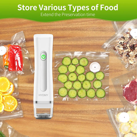 Portable Vacuum Sealer For Food With Detachable And Visible Water Tank next to vacuum-sealed bags of sliced cucumbers and vegetables.