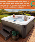 Outdoor hot tub with white interior and dark wood panels; two people relaxing on a wooden deck, built-in control panel visible