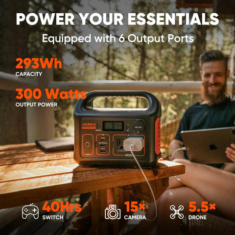 Portable Power Station Explorer 300 293Wh Backup Battery Solar Generator on a wooden table outdoors during camping.