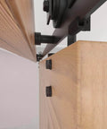 Close-up of 8FT Barn Door Hardware Kit with Heavy Duty Sliding Track, showing J Shaped Carbon Steel System installed on wooden door panel.