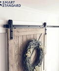 8.2 FT Sliding Barn Door Hardware Kit with J Shape hanger, installed on wooden door, smooth and quiet track system