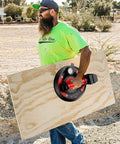 Man using 8-Inch Glass Suction Cup With Metal Handle, Electric Vacuum Lifter Clamp on plywood, outdoor setting