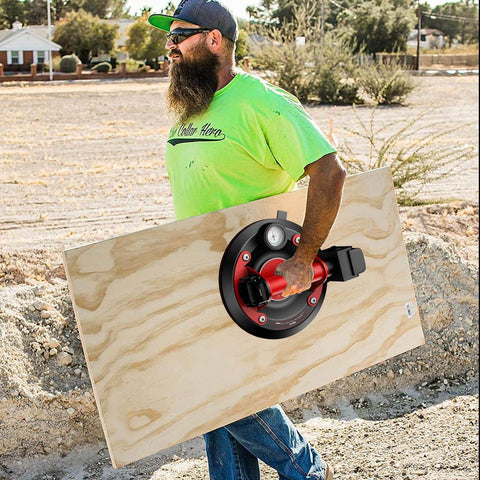 Man using 8-Inch Glass Suction Cup With Metal Handle, Electric Vacuum Lifter Clamp on plywood, outdoor setting