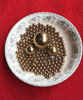 8mm 200pcs Solid Pure Copper Balls - Brass Ball Bead in decorative dish, showcasing precision-made copper beads for various uses