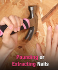 8 Oz Claw Hammer With Fiberglass Handle For Easy DIY Projects used for nailing into wood surface, close-up of hands in action