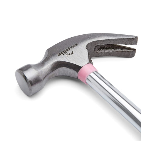 8 oz claw hammer with a shock-absorbing non-slip pink grip for comfortable, accurate nail driving and efficient nail removal; durable steel head and claw deliver reliable control for home improvement and professional tasks