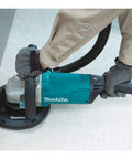 9 Inch Concrete Planer With Dust Extraction Shroud For Durable Surface Finishing, Efficient Material Removal, And Coating Removal, 6600 RPM From A 15 Amp Motor, Powerful Heavy Duty Concrete Surfacing Tool in use on concrete surface.