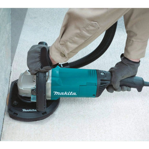 9 Inch Concrete Planer With Dust Extraction Shroud For Durable Surface Finishing, Efficient Material Removal, And Coating Removal, 6600 RPM From A 15 Amp Motor, Powerful Heavy Duty Concrete Surfacing Tool in use on concrete surface.
