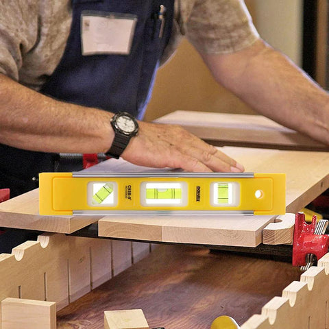 9 Inch Magnetic Box Level Torpedo Level With 3 Bubbles For 45 Degree 90 Degree And 180 Degree Angles in use on wooden surface