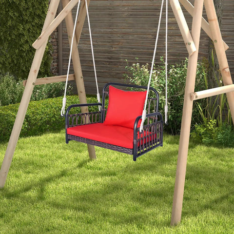 Red Wicker Porch Swing Chair For One With Cushioned Seat And Back, Reinforced Metal Frame in garden setting