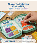 KeepGoing first aid kit refill in mint green zip case with 86 colorful packets.