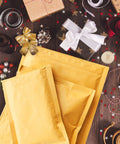 Kraft Bubble Mailers 8.5x12 Self Sealing Padding Envelopes 25 Pack Cushioned Shipping Bags amidst festive gift wrapping items