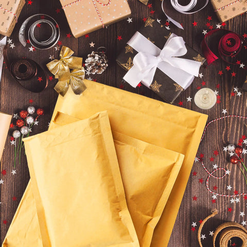 Kraft Bubble Mailers 8.5x12 Self Sealing Padding Envelopes 25 Pack Cushioned Shipping Bags amidst festive gift wrapping items