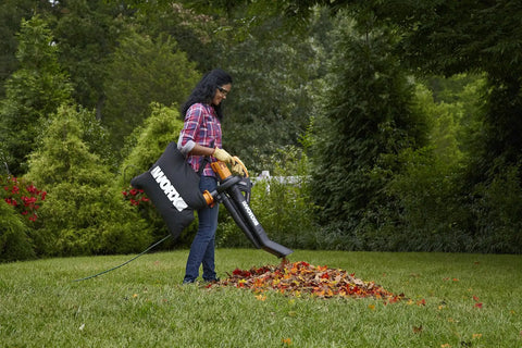 Person using 3 In 1 Leaf Blower Mulcher Vacuum For Easy Lawn Care With 350 CFM Airflow And 210 MPH Mulches Leaves At 18 To 1 Ratio WG509 on grass