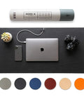 Pebble Black Leather Desk Mat With Cable Organizer 35 By 17 Inches, Premium Vegan PU Desk Pad And Mouse Mat shown with laptop