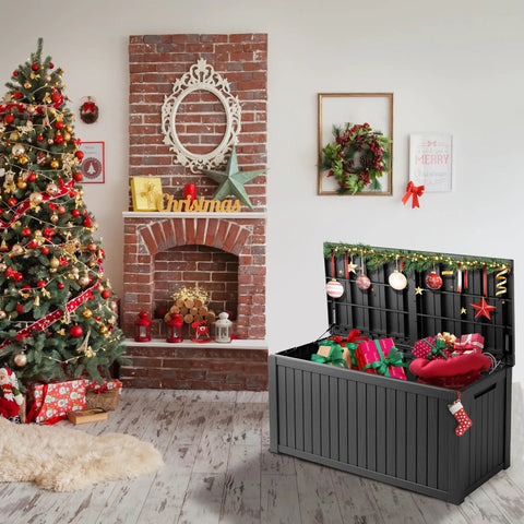 200 Gallon Waterproof Outdoor Storage Box Built Tough Resin Deck Box With Lockable Lid beside Christmas tree indoors
